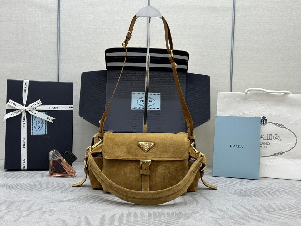 Prada suede shoulder bag with flap and gold-tone hardware, adjustable strap