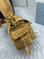 Prada suede mini bag close-up of buckle strap and front flap pocket