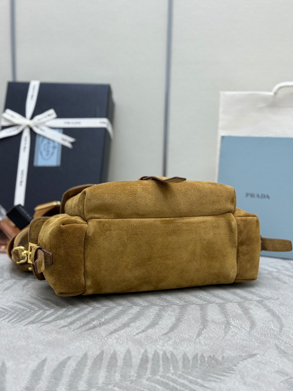 Prada suede duffel-style bag with foldover top and gold-tone hardware