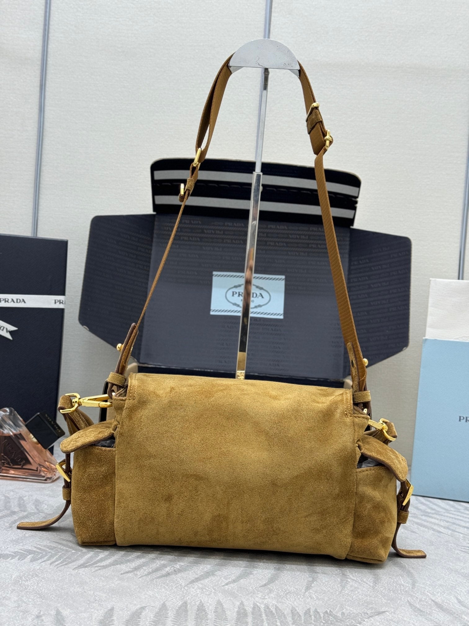 Prada suede shoulder bag with top flap, gold-tone chain strap, hobo shape
