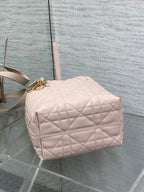 Quilted pale pink mini handbag with top handle and gold hardware