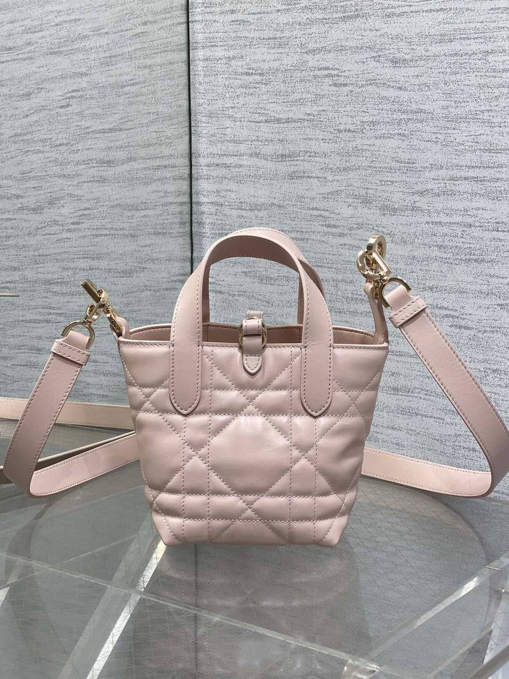 Dior quilted mini handbag with shoulder strap, light pink and gold-tone clasp detail