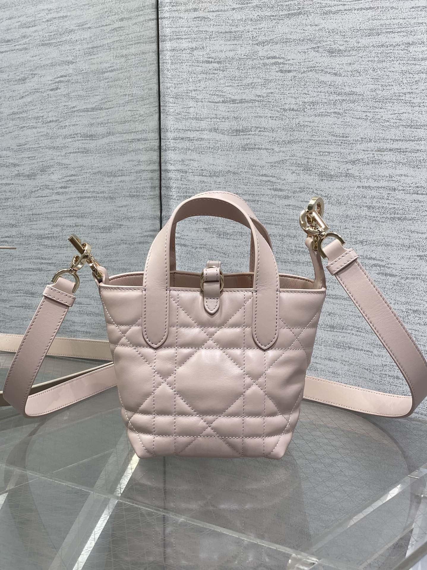 Dior quilted mini handbag with shoulder strap, light pink and gold-tone clasp detail