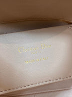 Christian Dior embossed leather label: “Christian Dior” and “MADE IN ITALY”