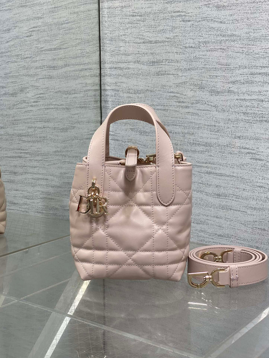Dior quilted mini handbag in light pink with top handles and gold-tone hardware