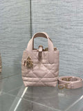 Dior quilted mini handbag in light pink with top handles and gold-tone hardware