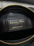 Leather bag interior label reading Christian Dior and Made in Italy