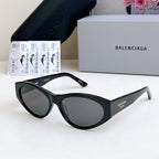 Balenciaga cat-eye sunglasses with dark lenses and black frame