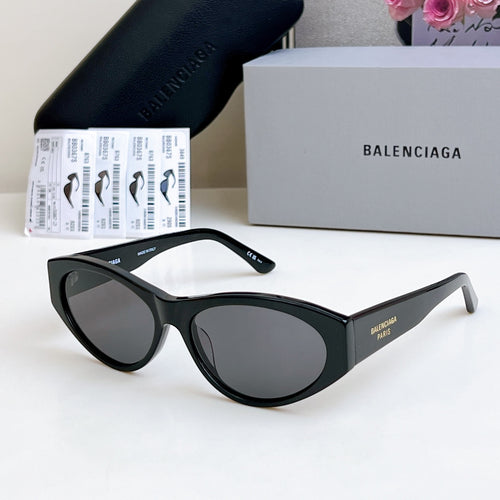Balenciaga cat-eye sunglasses with dark lenses and black frame