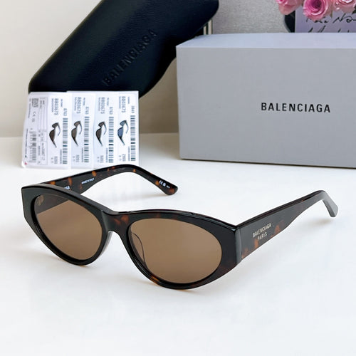 Balenciaga cat-eye sunglasses with brown-tinted lenses and black frame