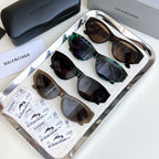 Set of Balenciaga sunglasses in multiple colors with dark lenses and frames