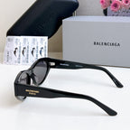 Balenciaga full-frame sunglasses with black frame and dark lenses