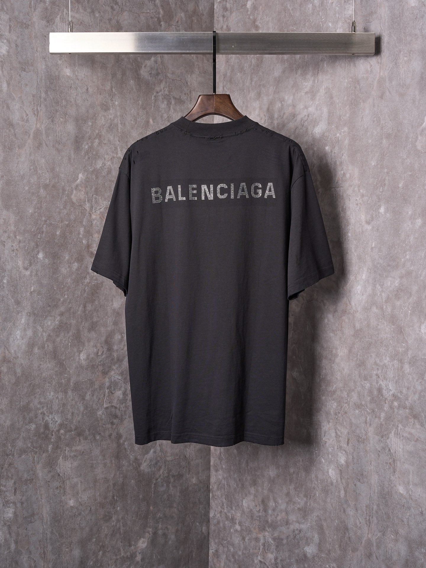 Balenciaga black short-sleeve T-shirt on hanger with BALENCIAGA back print