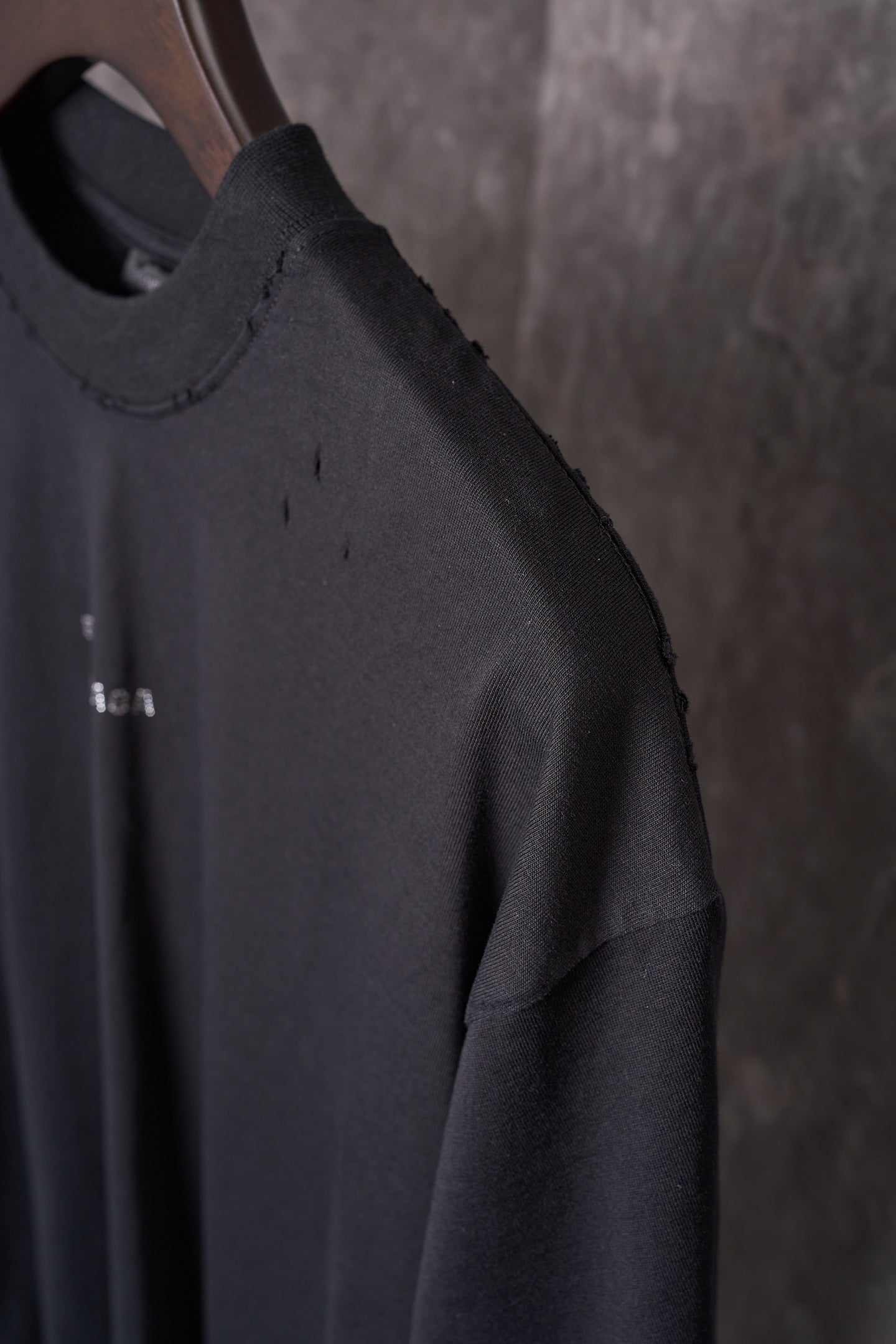 Balenciaga black short-sleeve T-shirt with small dotted logo on sleeve