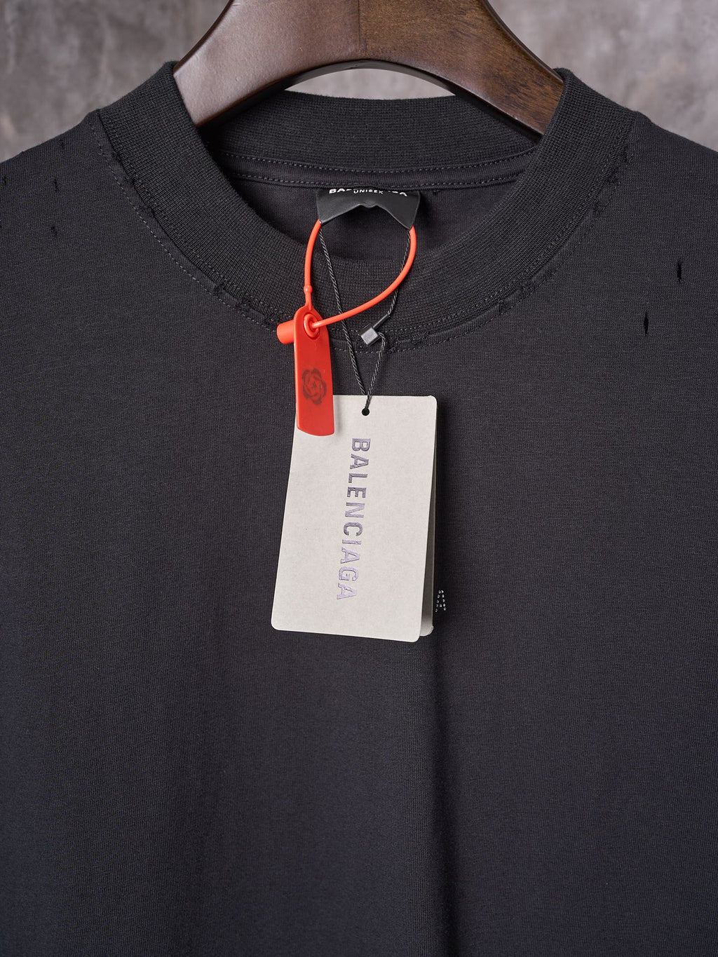 Balenciaga black crew-neck T-shirt with red drawstring and hanging tag