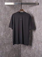 Balenciaga black short-sleeve T-shirt on hanger with small chest logo