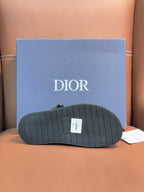 Dior sandals outsole view, ribbed dark sole with Dior tag