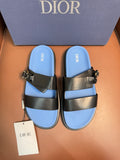 Dior luxury sandals with black leather straps and gold buckle, blue footbed