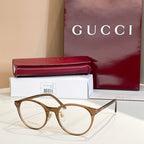 Gucci glasses with gold round frames and clear lenses