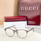 Gucci glasses with silver round frames and clear lenses