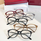 Gucci glasses set with red, black, gold, and gray-blue round frames