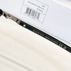 Gucci glasses temple close-up with printed brand text and label