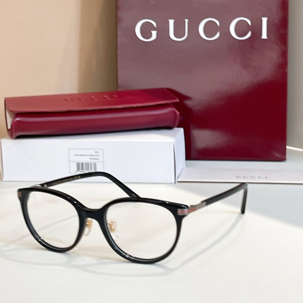 Gucci glasses with black round frames and clear lenses
