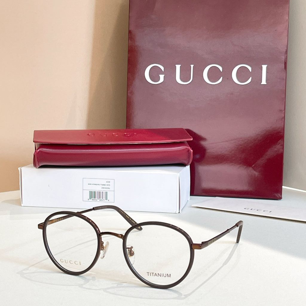 Gucci round eyeglasses, dark metal frame with clear lenses