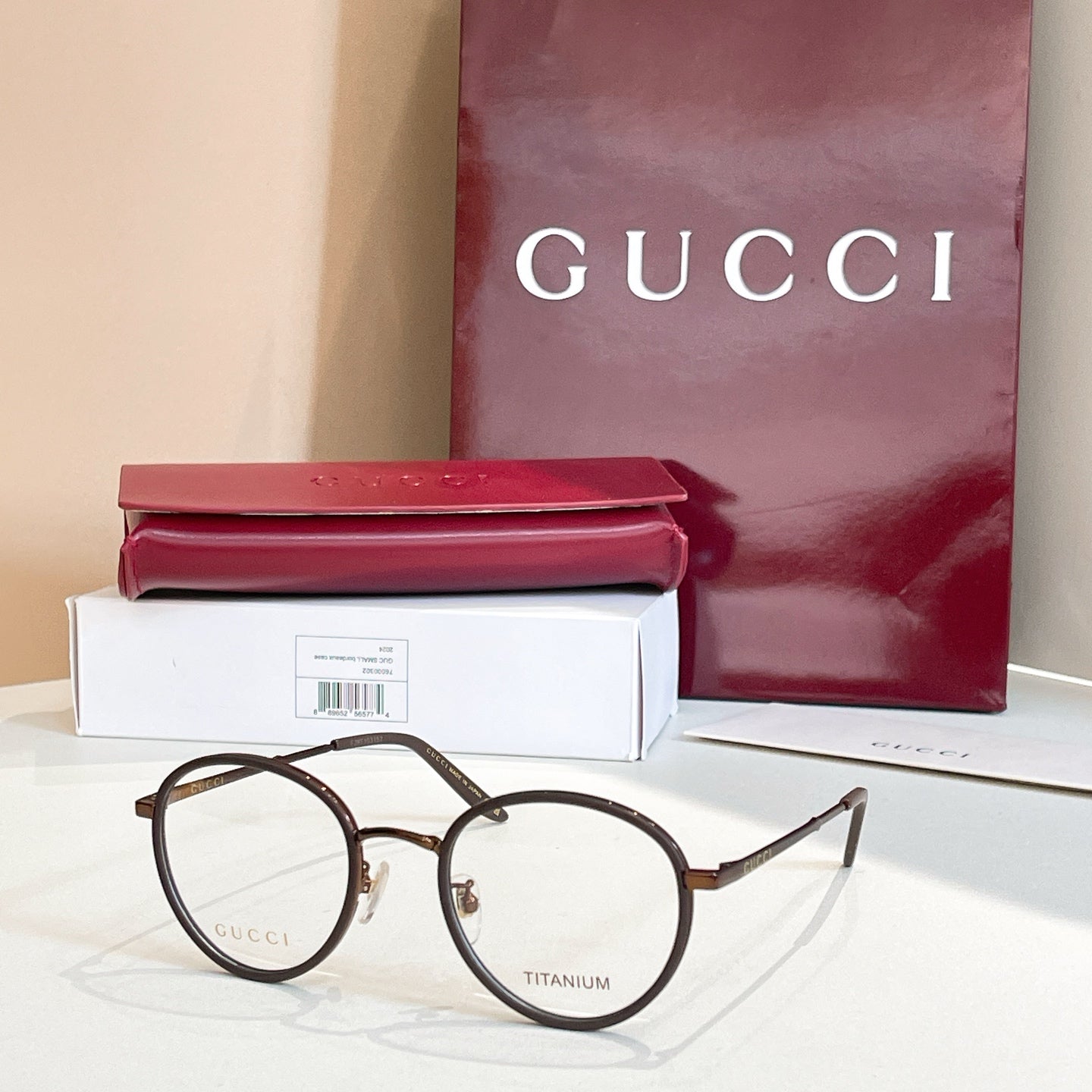 Gucci round eyeglasses, dark metal frame with clear lenses