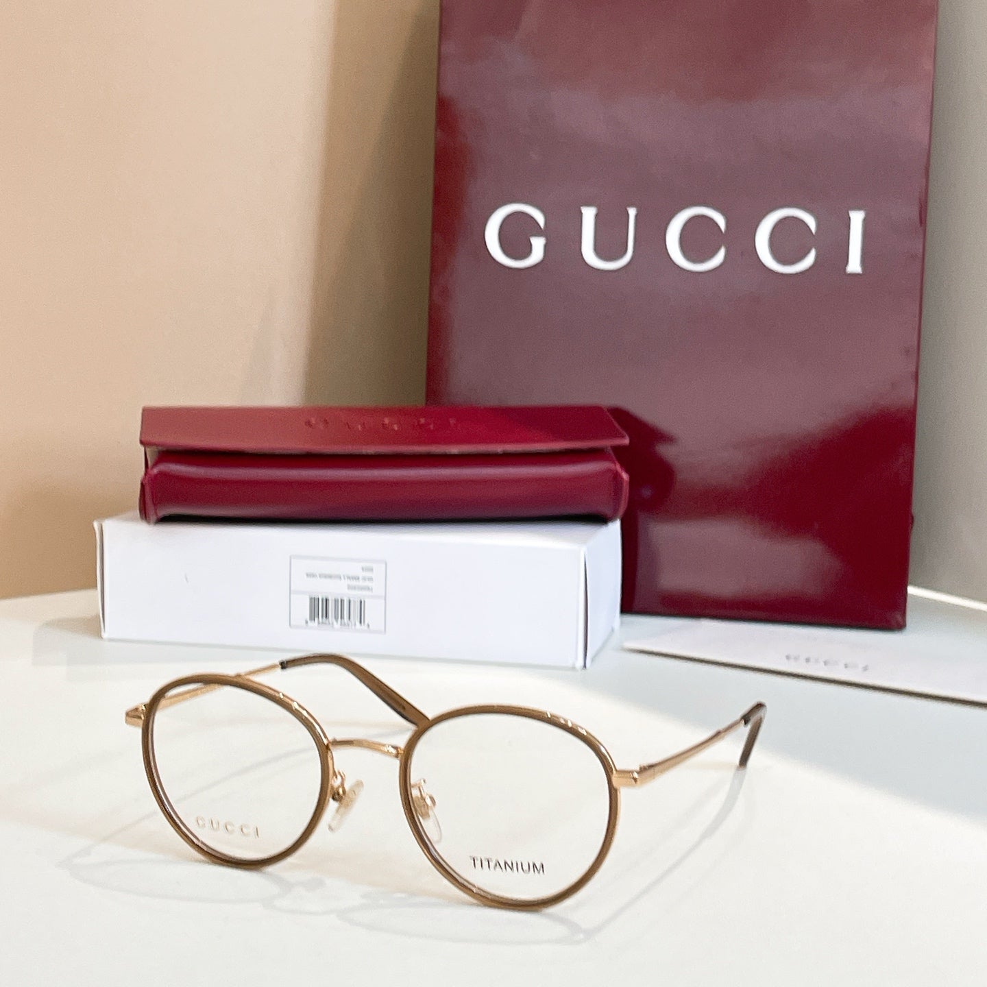Gucci round eyeglasses, gold metal frame with clear lenses