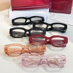 Eyeglasses display with black, red, orange, and pink frames and GG logo details