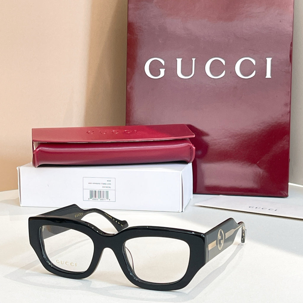 Eyeglasses with black frames and gold-tone side GG logo detail