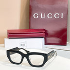 Eyeglasses with black frames and gold-tone side GG logo detail