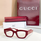 Eyeglasses with dark red frames and gold-tone side GG logo detail