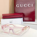 Eyeglasses with translucent pink frames and gold-tone side GG logo detail