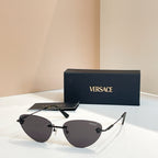 Versace sunglasses with dark tinted lenses and mixed black and gold frame, V logo