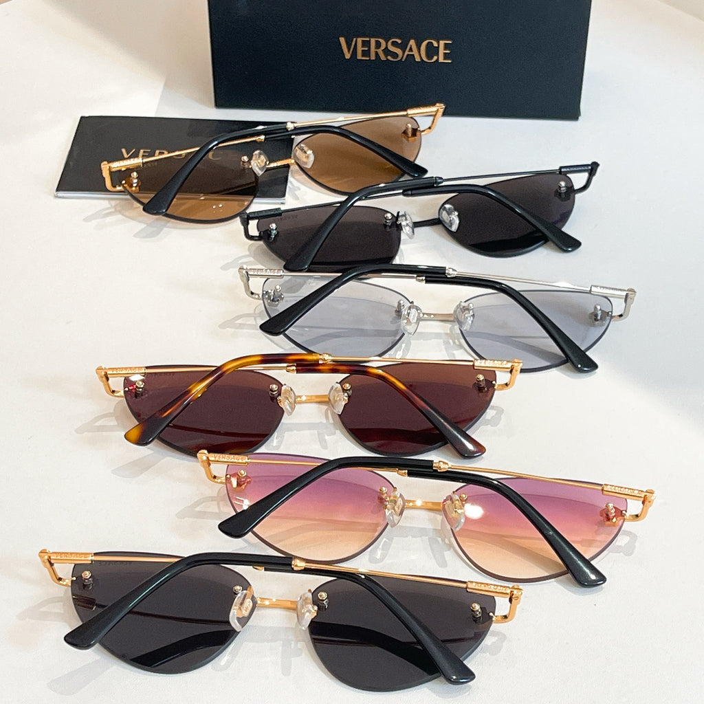 Versace eyewear set with black and gold frames and tinted lenses, V logo on arms