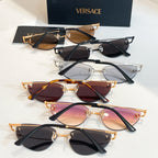 Versace eyewear set with black and gold frames and tinted lenses, V logo on arms