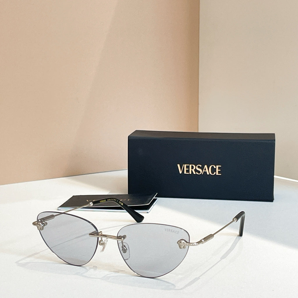 Versace eyeglasses with gold thin metal frame and light lenses, V logo on arms