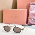 Miu Miu round sunglasses with silver frame, gray tinted lenses, thin arms