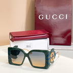 Square green sunglasses with gray lenses and blue-and-gold logo on side arms