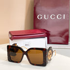 Square dark tortoiseshell sunglasses with amber lenses and gold logo on side arms