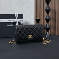 Chanel quilted leather shoulder bag in black with gold chain and CC clasp