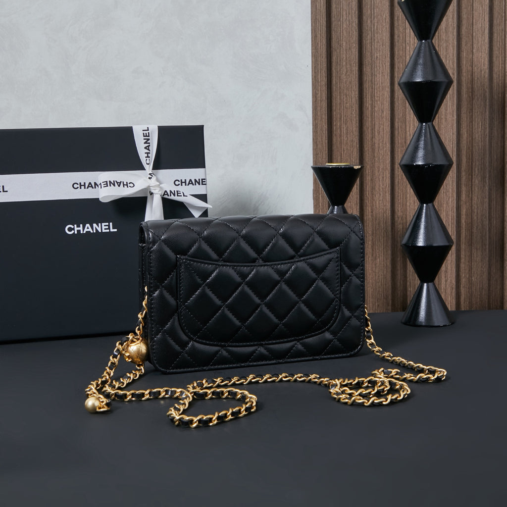 Chanel quilted leather crossbody bag in black with gold chain, front view