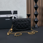 Chanel quilted leather crossbody bag in black with gold chain, front view