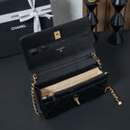 Chanel small flap bag in black leather with gold chain and top handle, open view