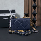 Chanel quilted flap shoulder bag, navy blue, with layered chain strap.