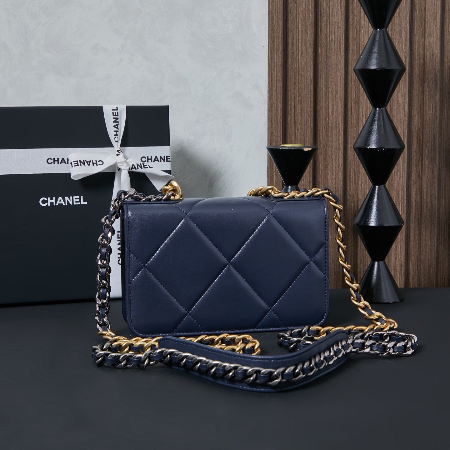 Chanel quilted flap shoulder bag, navy blue, with layered chain strap.