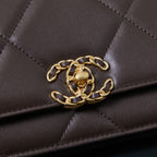 Chanel quilted bag close-up showing gold chain strap attachment