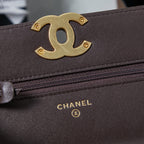 Chanel logo plaque and zip close-up on quilted leather flap bag